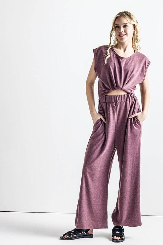 Front view of Kora Wide Leg Jumpsuit in latte with twist-front tie detail.