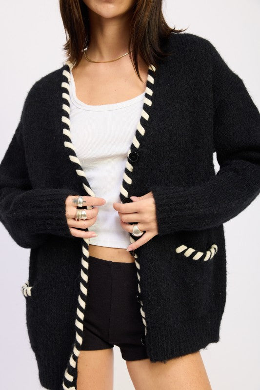 Front view of Londyn Trim Cardigan showing button closure and pocket details