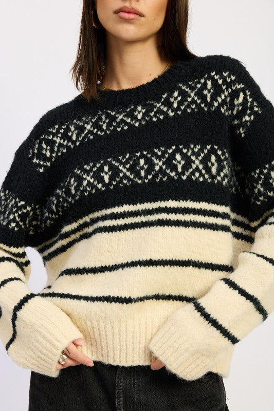 Close up of neckline on Adaline Fair Isle Striped Oversized Sweater in black cream, round neck knit.