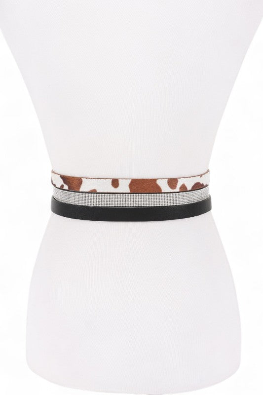 Back view of Dhara Belt Set on mannequin highlighting sleek faux leather straps.