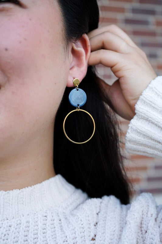 Woman wearing Sadie Earrings – Navy, showing glossy acrylic and gold detail.