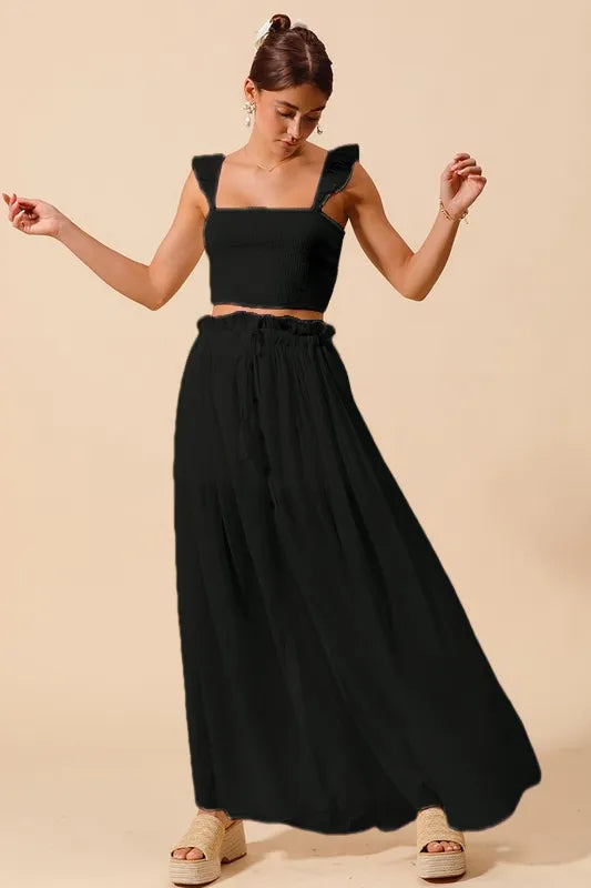 Front view of Kora Smocked Top and Black Maxi Skirt Set, showing square neckline, ruffled sleeves, and flattering high-waisted skirt.