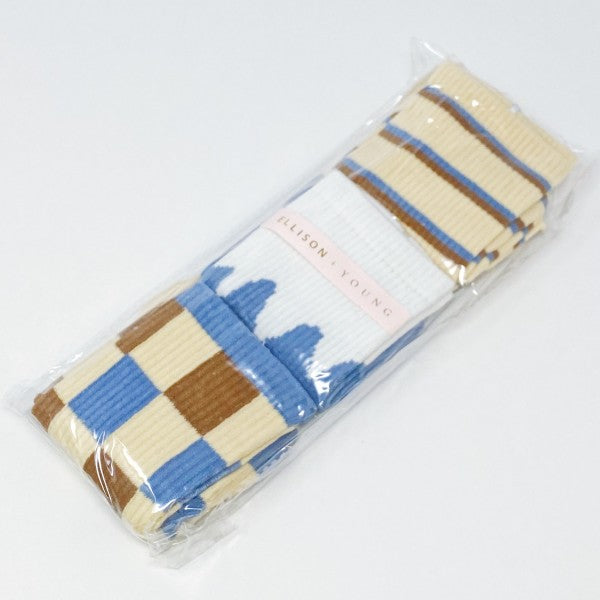Packaged Trendy Pattern Trio Socks Set in clear cello bag with Ellison + Young logo sticker.