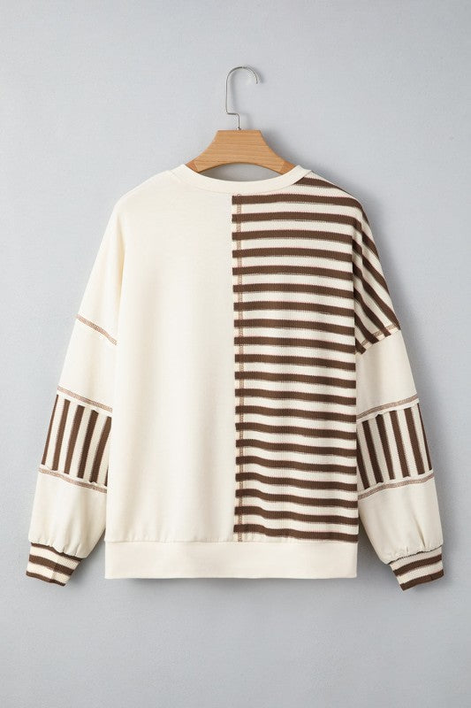 Back of Ariana Stripe Stitched Oversized Sweatshirt on hanger with stripe placement