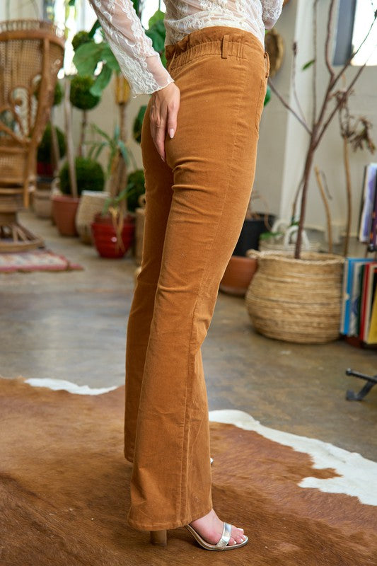 Side angle of Taran Camel Corduroy Flare Pants showing stretch corduroy and wide flare