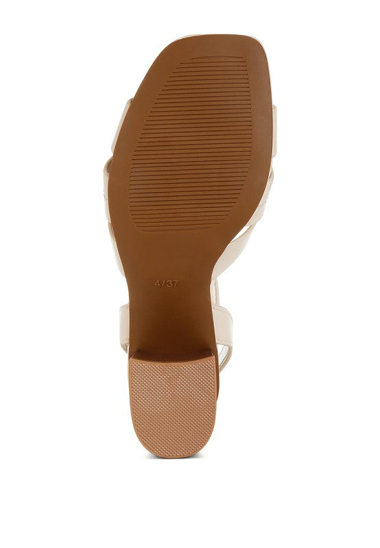 Bottom sole view of beige Signora Ankle Strap Sandals with rubber outsole.
