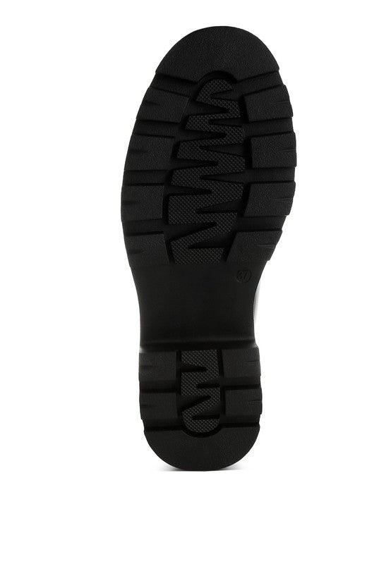 Bottom view of Black Gleam Stride Chunky Loafers with lug sole and durable rubber outsole.