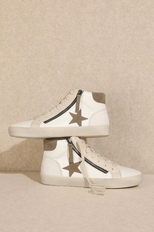 Side view of white Super Star high top sneaker showing star embellishment and zipper closure