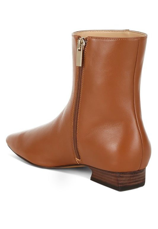 View of Obita Leather Ankle Boots in tan showing zipper closure.