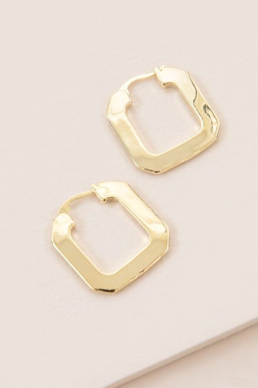 Flat lay top view of gold Modern Blocked Hoops with square edges