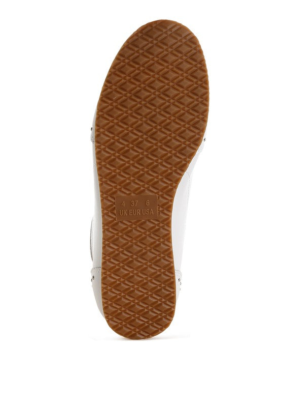 Bottom view of white Odaya Studded Leather Sneakers by Rag Company, showing textured TP rubber outsole for grip and durability.
