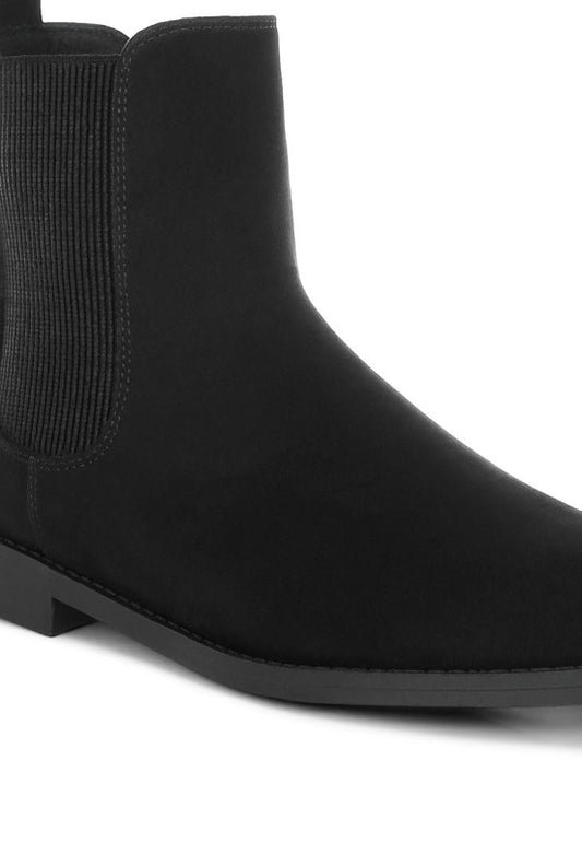Close up of Ayasa Low Block Heel Chelsea Boots in Black showing faux suede texture and low heel