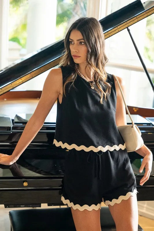 Trendy Black Matching Set with Ric Rac Trim, Featuring Frill Accents and Comfortable Fit.