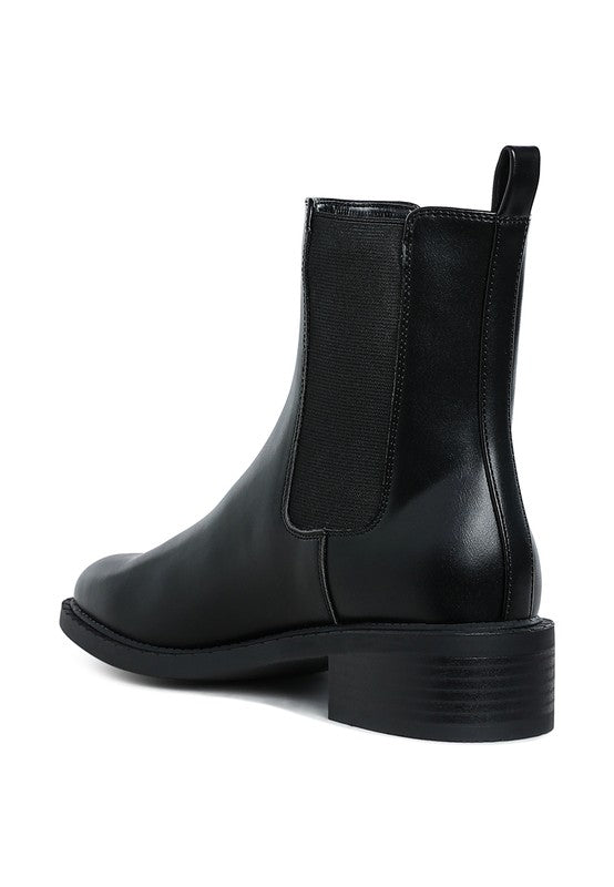 Back angle of Tripoli Stacked Heel Chelsea Boots showing stacked block heel and smooth vegan leather finish.