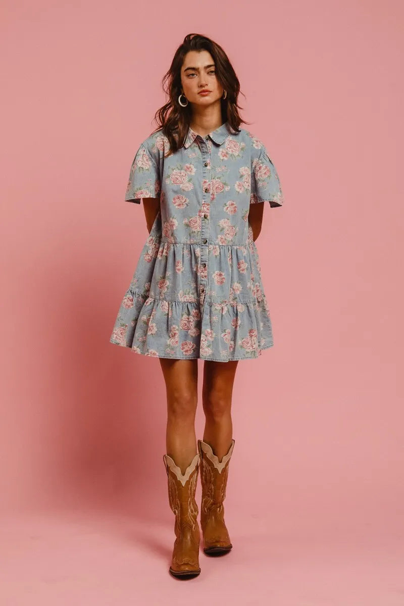 Full body view of Isla Floral Shirt Dress in denim blue with pink florals, styled casually for a breezy daytime look.