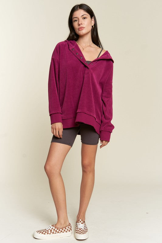 Kenzie Hooded Sweatshirt in Magenta showing buttons and ribbed knit detail.