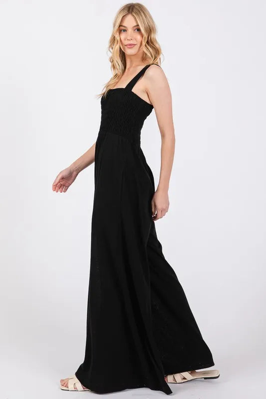 Flowy Wide Leg Jumpsuit with Smocked Bodice - A Must-Have for a Chic, Relaxed Outfit in Black.