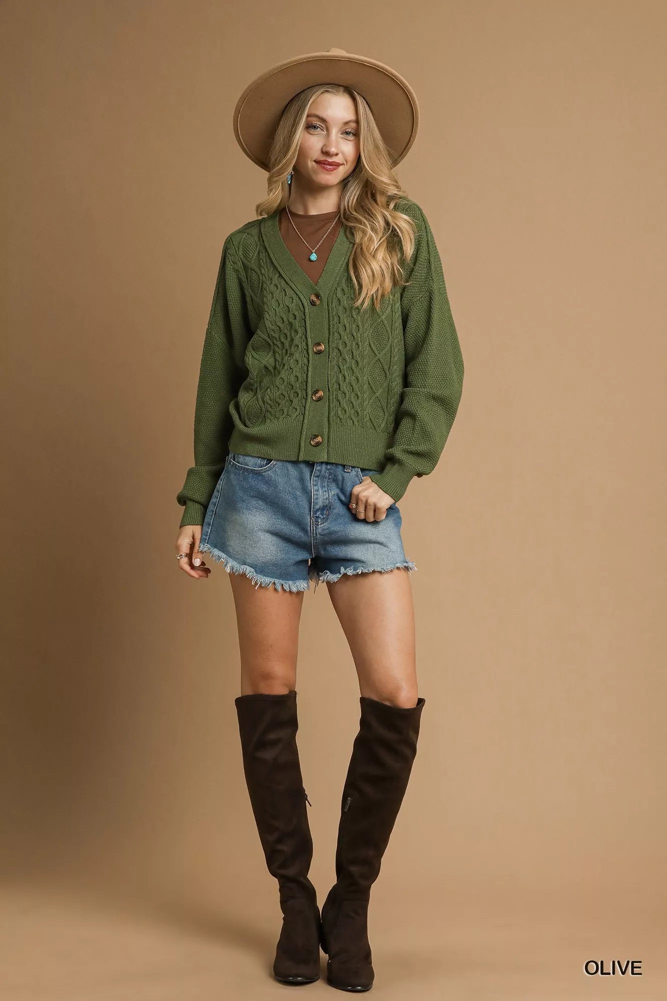 Uma Olive Cardigan cropped length styled with high-rise shorts, front view.