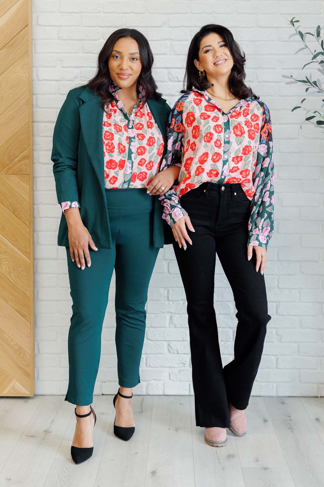 Two women wearing Gisselle Mixed Print Blouse in different sizes styled uniquely with floral colorblock design