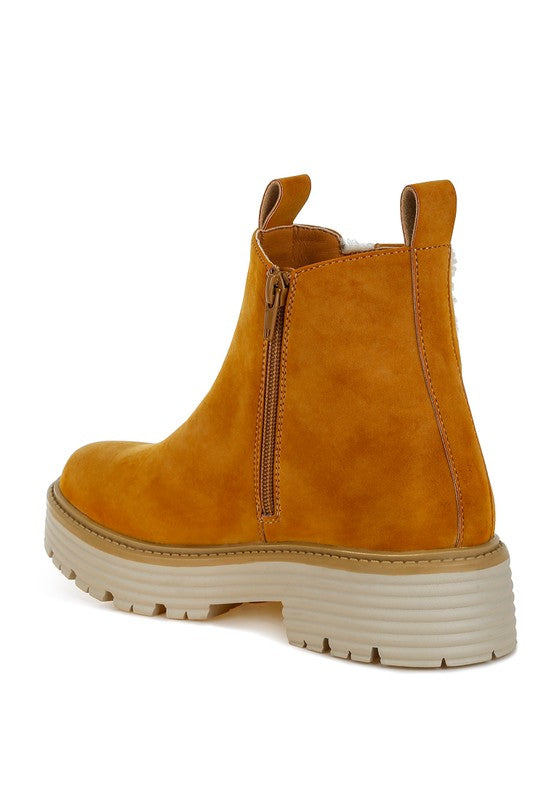 Back inside view of Tan Mothman Chunky Ankle Boots highlighting zipper closure and heel design.
