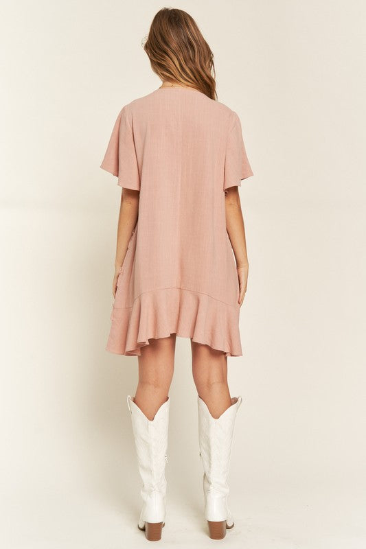 Back view of model wearing Mauve Gentry Curvy Tiered Ruffle Mini Dress, highlighting ruffle tiers and breezy fit.