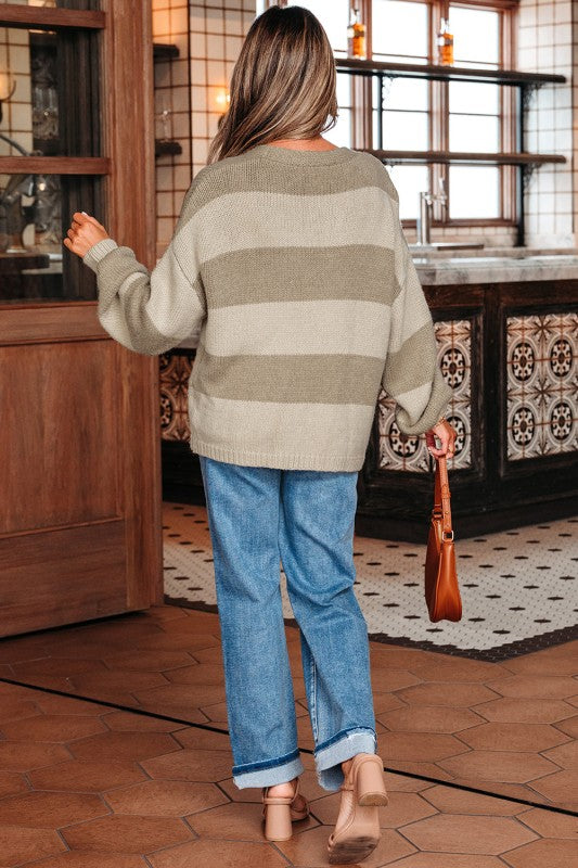 Back view of striped knit bow tie cardigan showing relaxed fit