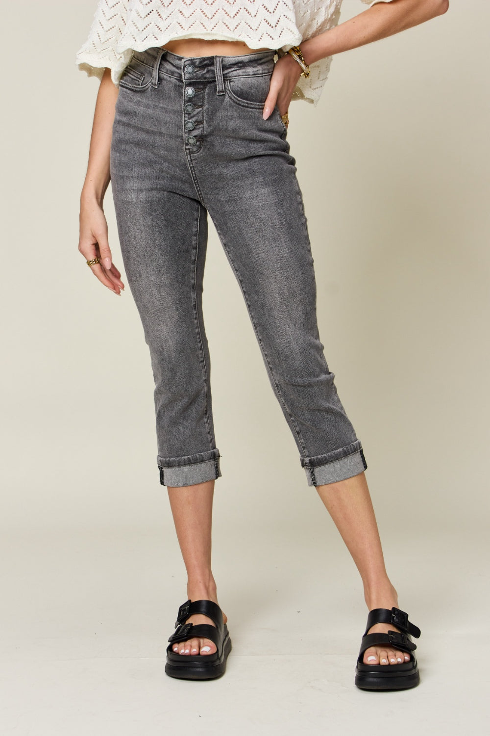 Front view of Evana cuffed capris with high waist silhouette and gray washed finish.