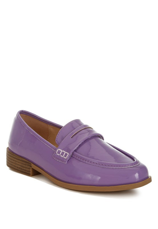 Front angle of Lilac Avery Patent Loafers with glossy patent vegan leather and penny strap detail.