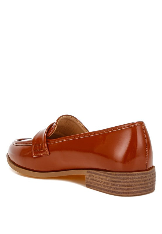 Back angle of Brown Avery Patent Loafers showing flat heel and TPR sole.