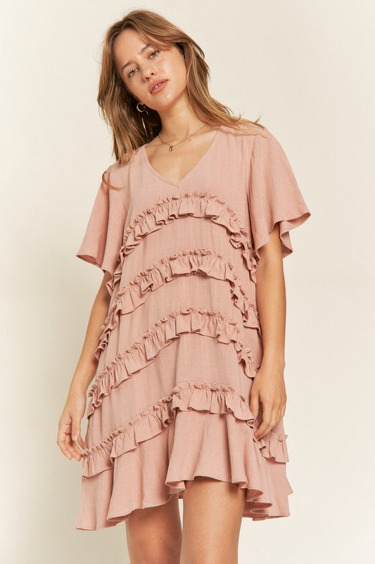 Front view of Gentry Tiered Ruffle Mini Dress in mauve with V-neckline and flared sleeves.