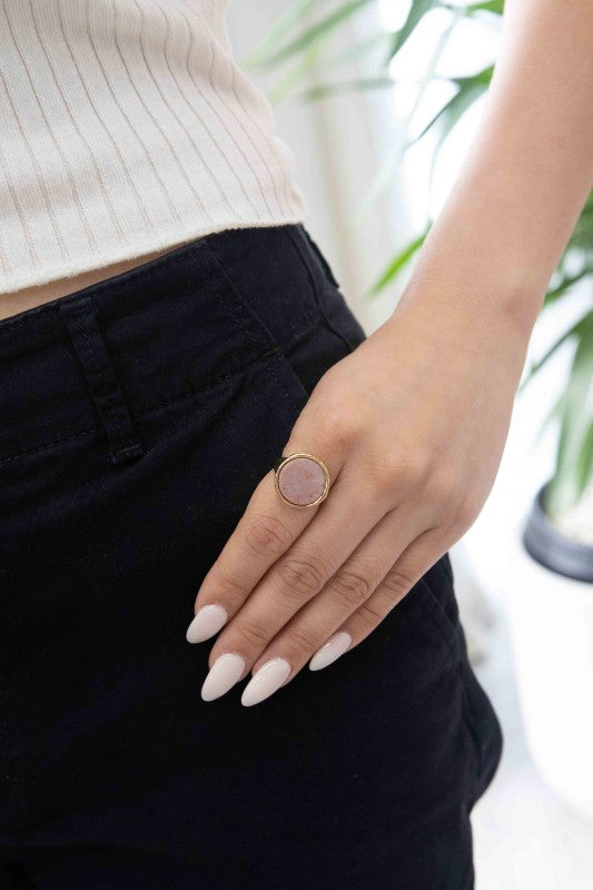 Woman wearing Ambition Stone Ring in Dusty Rose styled with casual outfit.