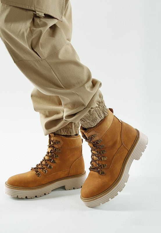 Side view of Tan Boskoff Lace-Up Chunky Ankle Boots showing lace-up front and durable lug sole.