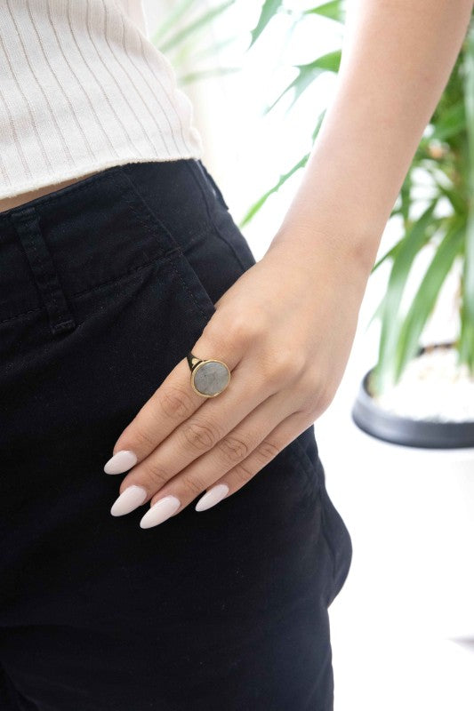 Woman wearing Ambition Stone Ring in Haze styled with neutral outfit.