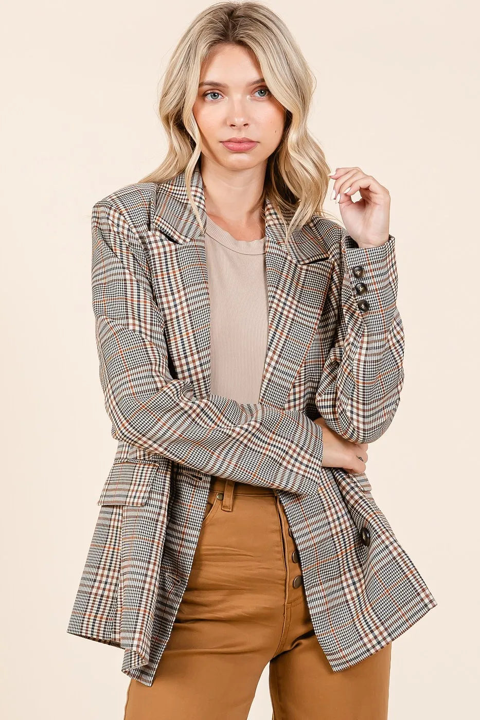 Front view of unbuttoned Lennon Plaid Blazer styled casually with brown jeans