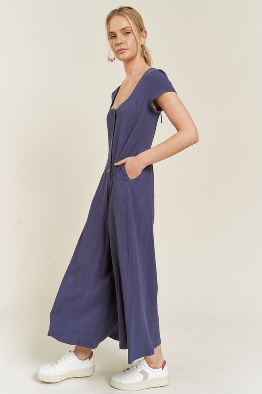 Navy Seona Linen Plus Size Jumpsuit side view highlighting relaxed fit and cropped leg design.