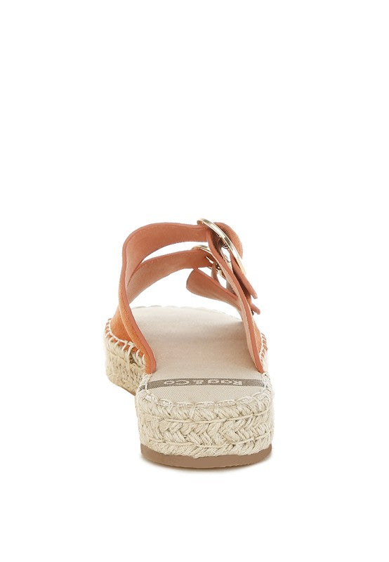 Tan genuine leather espadrille flatform sandal back view showing ankle strap, buckle closure, and espadrille heel.