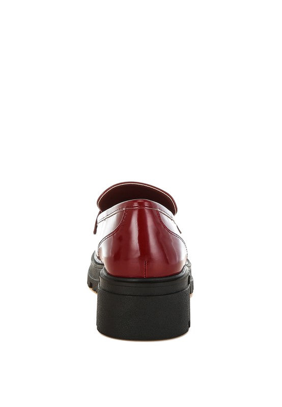 Back view of Burgundy Gleam Stride Chunky Loafers with block heel, lug sole, and cushioned insole.