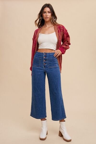 Full body view of Frankie cropped wide leg jeans paired with boots for a retro-chic look.