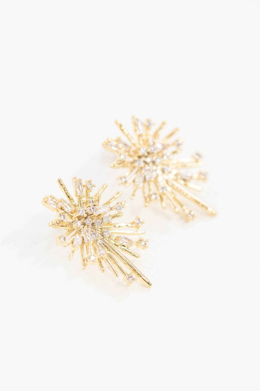 Angled view of Flare Post Earrings with radiant gold burst design