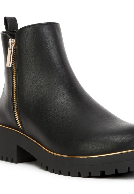 Close-up of Black Thorin Block Heel Boots highlighting metallic zipper and frame details.