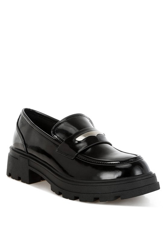 Front angle of Black Gleam Stride Chunky Loafers with penny strap detail and faux leather finish.