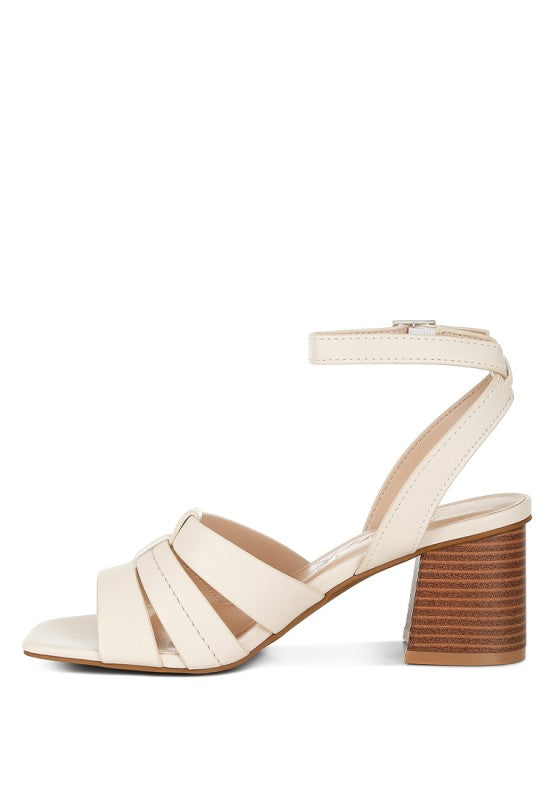 Side view of beige Signora Ankle Strap Sandals with 2-inch block heel.