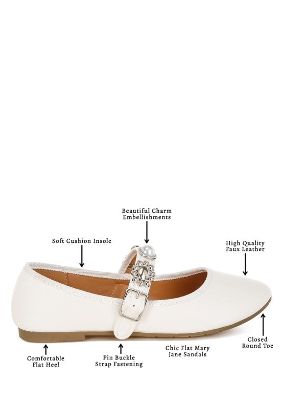 Infographic of white Kavana Mary Jane Flats highlighting charm embellishments, cushioned insole, buckle strap, round toe, and flat heel.