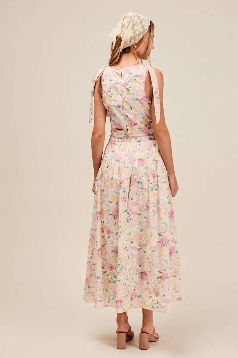 Back view of Soraya Floral Two-Piece Set with tie-back crop top and flowy tiered maxi skirt.