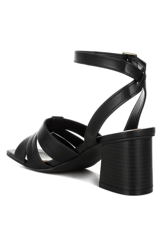Back angle of black Signora Ankle Strap Sandals with stacked block heel.