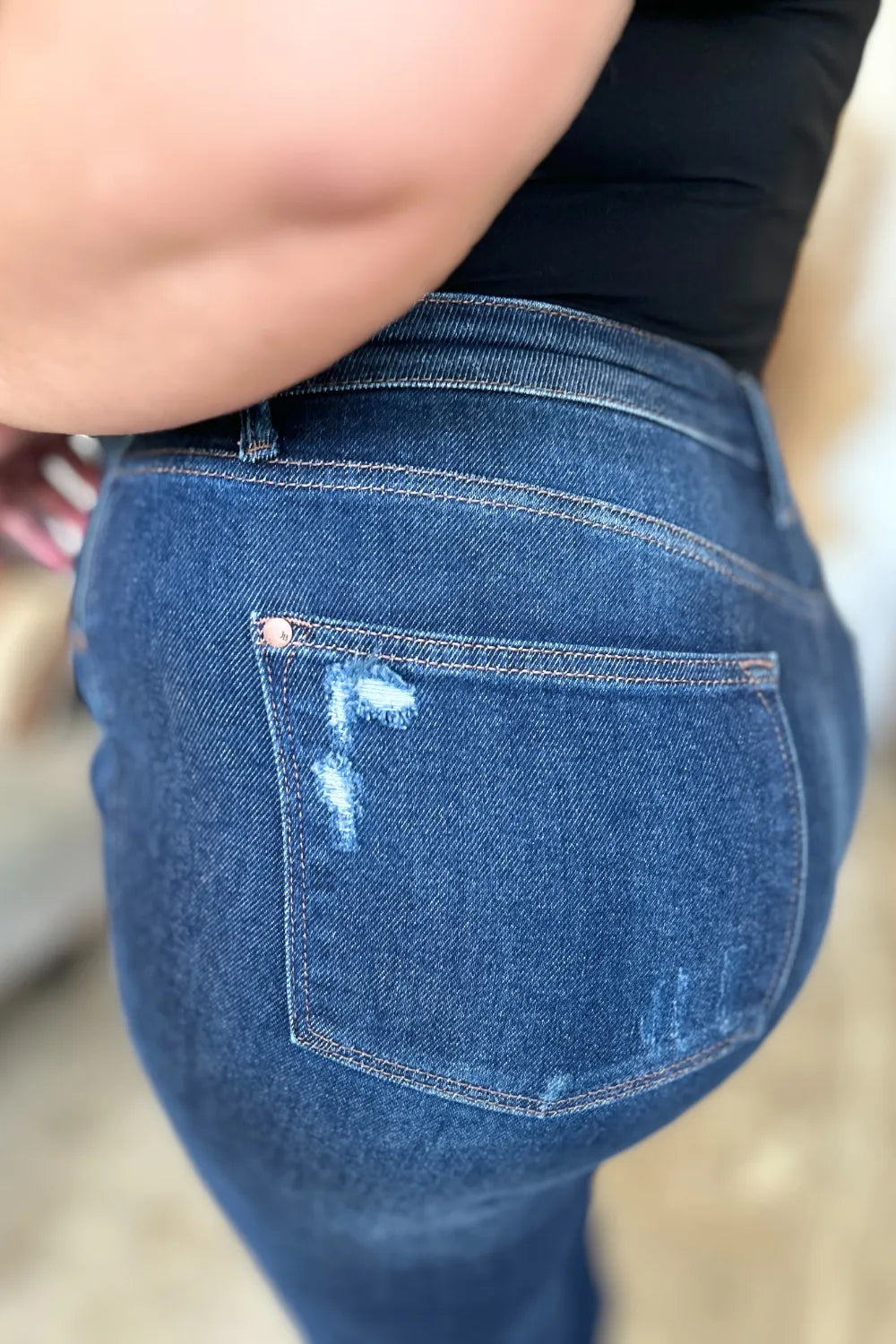 Close-up of Wynna Jeans back waistband and pocket stitching