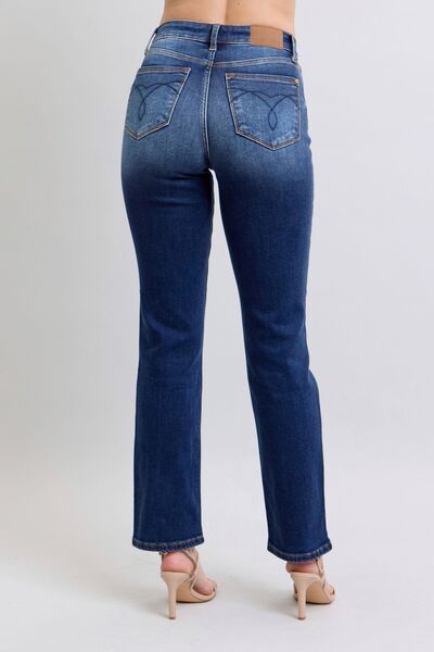 Back view of Carson Straight Leg Jeans with dark wash finish, mid rise, and classic pocket styling.
