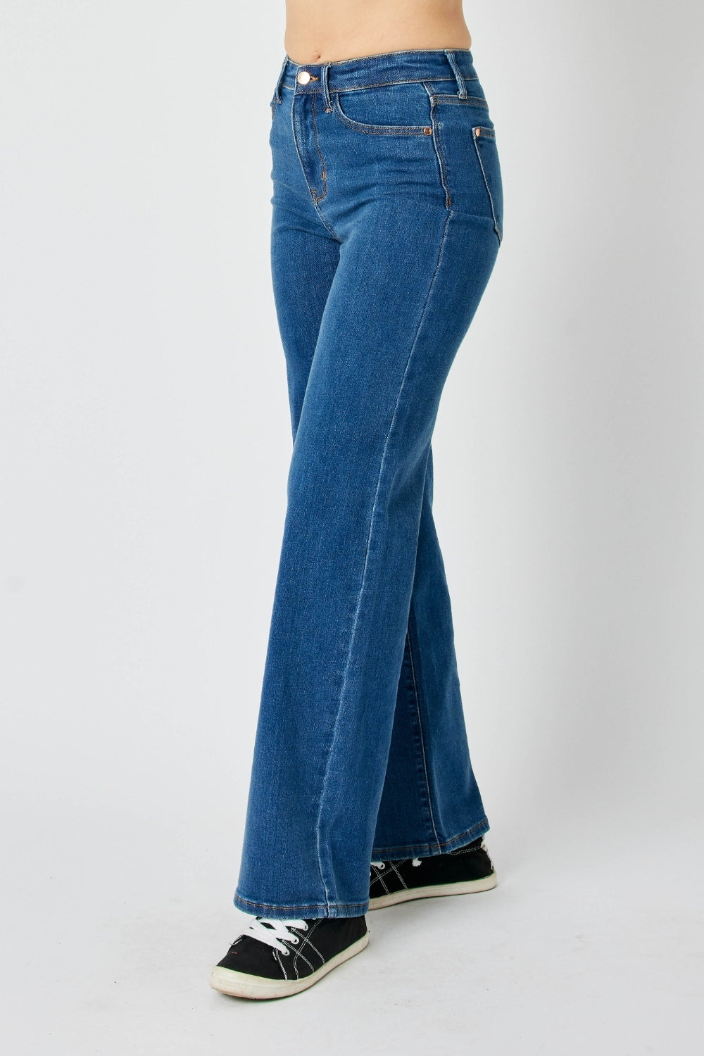 Side angle view of Miriam Straight Jeans in medium wash with high rise waist.