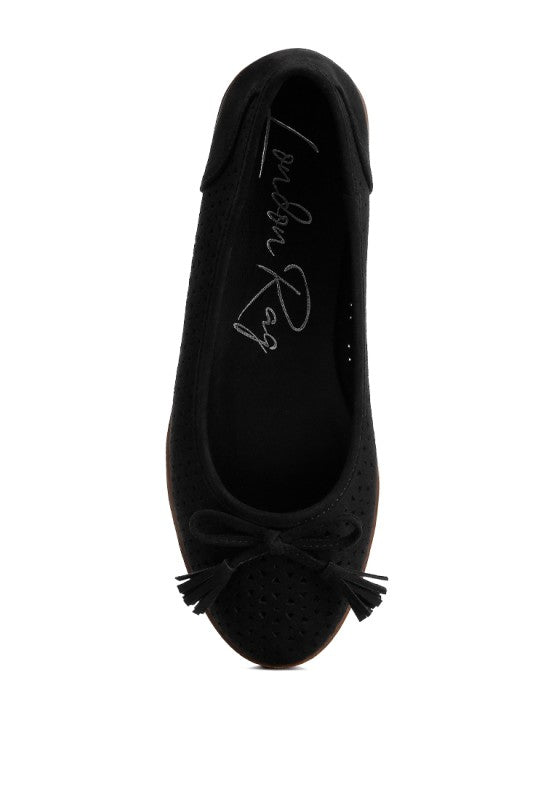 Top view of black Pacer vegan leather ballerina flat displaying the perforated pattern and centered bow embellishment.