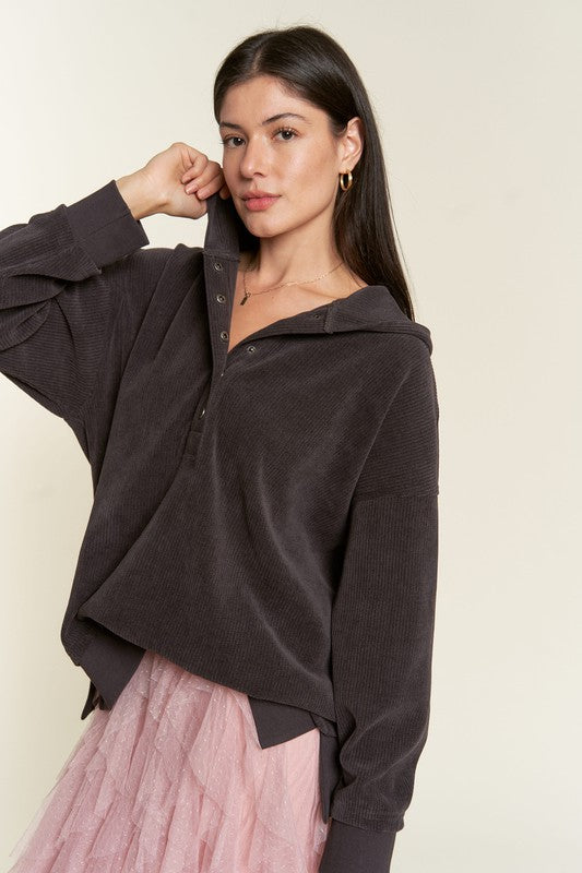 Kenzie Hooded Sweatshirt paired with pink skirt.